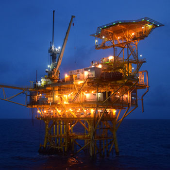 An oil rig platform at night